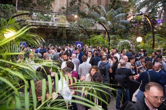 Attendees enjoying the after-party in the Barbican's leafy surroundings.