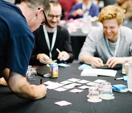 Attendees collaborating in a workshop.